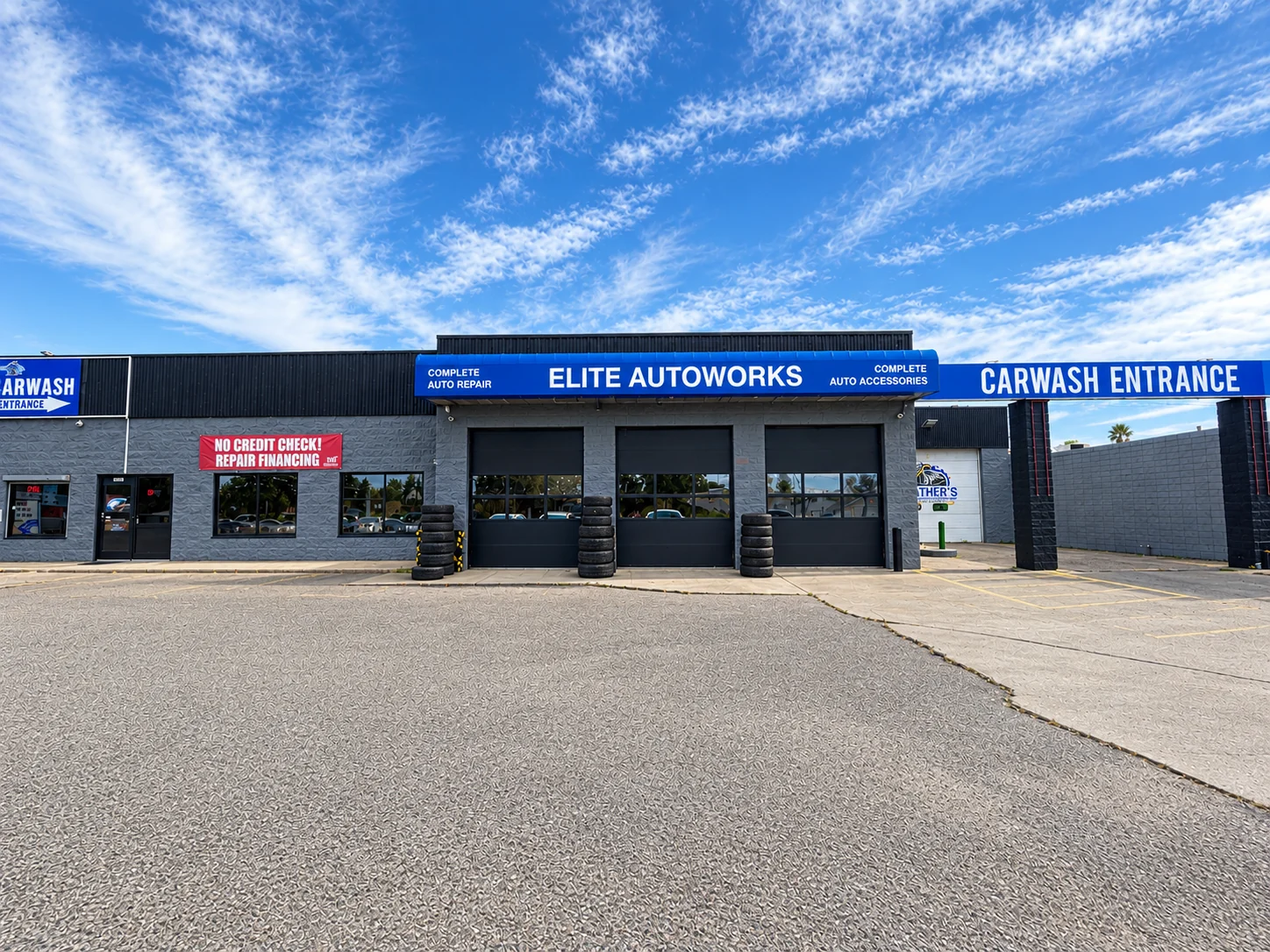 Wide view of the Elite Autoworks building and parking lot