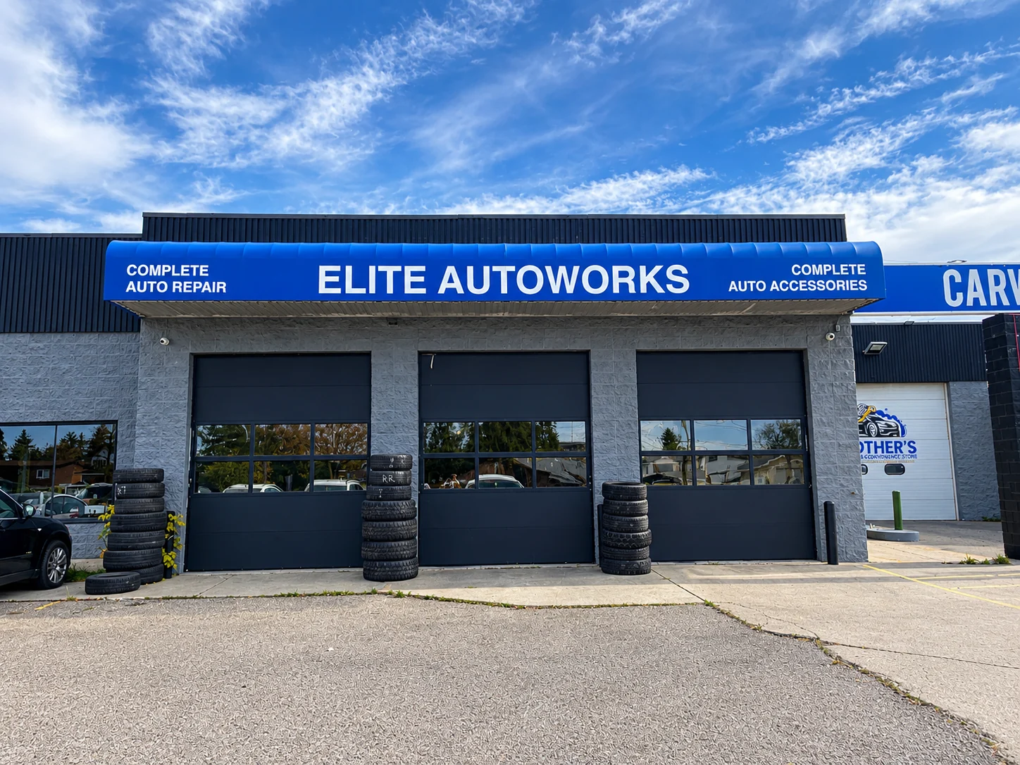 Elite Autoworks storefront with three service bay doors