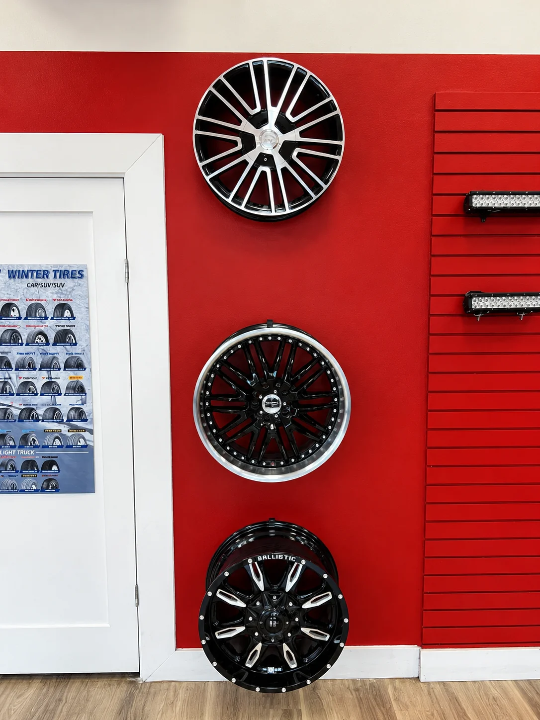 Wheel display and winter tire information on a red wall